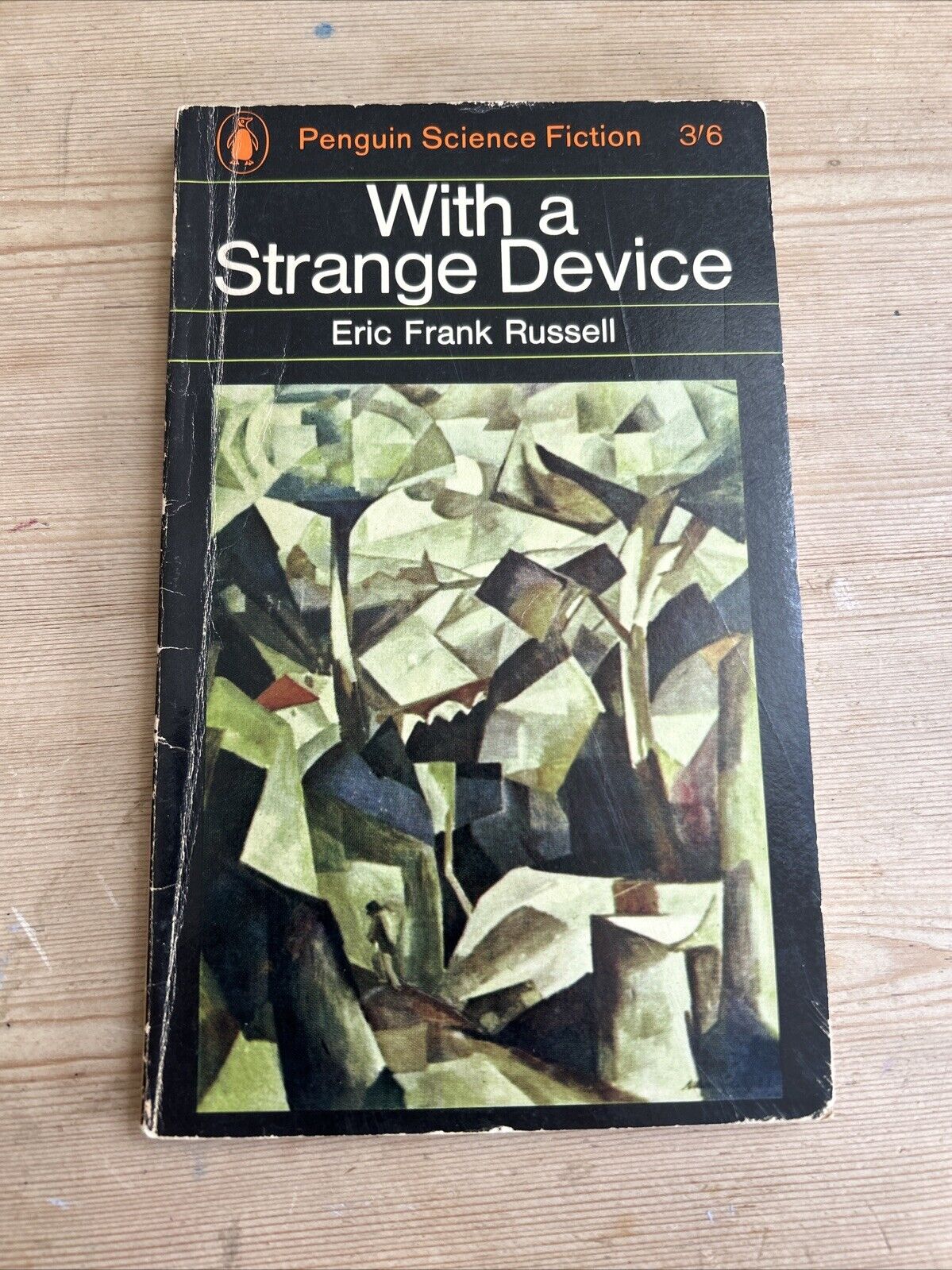 WITH A STRANGE DEVICE E F Russell PENGUIN SCIENCE FICTION Book 1965 N 2358 First